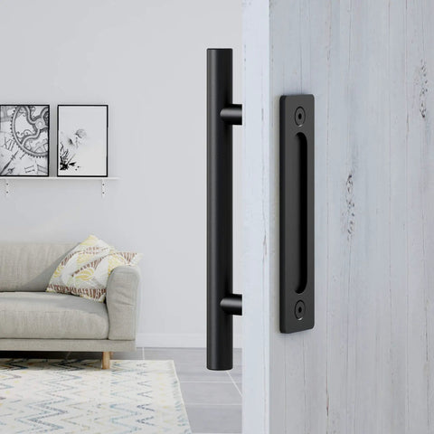 Heavy Duty Pull And Flush Door Handle Set In Matte Black For Sliding Barn Doors Fits Doors Up To Two And Three Eighths Inches And Built Tough With Rust Resistant Steel And Ultra Thin Backplate installed on a light wooden door.