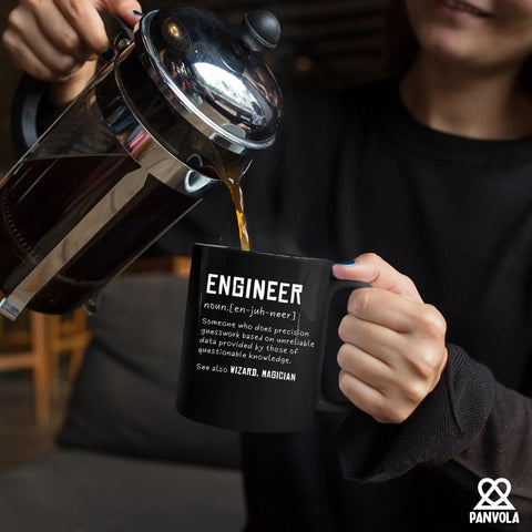 Person pouring coffee into Engineer Definition Ceramic Mug 11 Oz Black Funny Gift For Engineering Students And Pros The Ultimate Gearhead Mug
