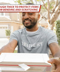 Delivery person holding Stay Flat Photo Mailers 6.5 By 4.5 Inch Self Seal Rigid Mailers Pack Of 200 in front of a house