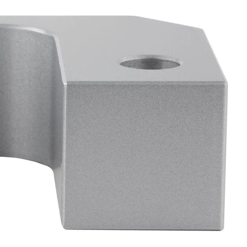 Close-up of a silver 1.5 Inch Front Leveling Kit For 2007 To 2016 Cadillac Escalade 2WD 4WD bottom mount strut spacer.