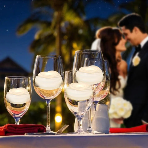 7 Piece Battery Operated Flameless LED Candles With Remote Timer, Waterproof on wine glasses at outdoor wedding