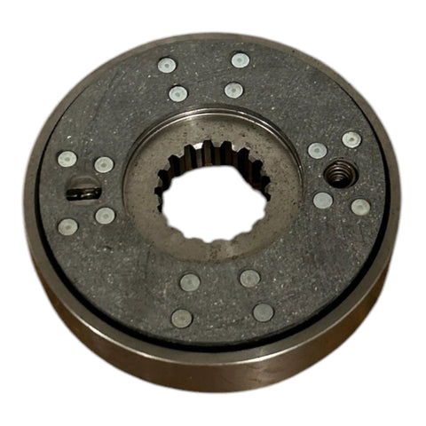 Front view of circular tractor brake assembly with a splined center bore and rivet-dotted friction surface