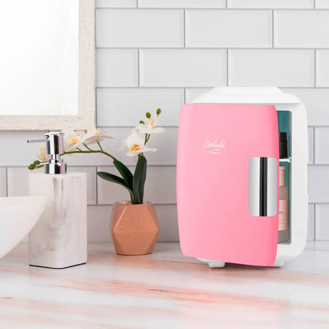 Dope Portable 4L Mini Fridge And Cooler Warmer For Bedroom, Car, Desk And Dorm Room, 6 Can Capacity, Pink Finish on counter