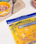 Zip N Steam Microwave Safe Food Storage Bag with ingredients on a cutting board, ready for meal prep
