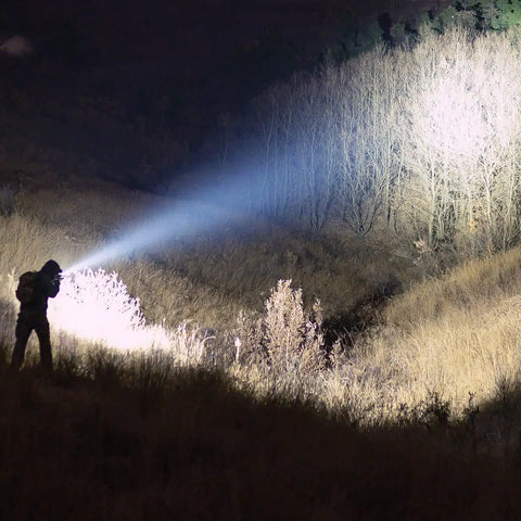Person using LH8 V2 Weapon Light Head Potted 5700K, 128000 CD, 1650 LM in field, illuminating long throw of 782.38 yards