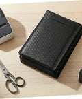 60 Pack Black Self-Sealing Bubble Mailers With Tear-Resistant PET Padding For Electronics And Cosmetics on desk
