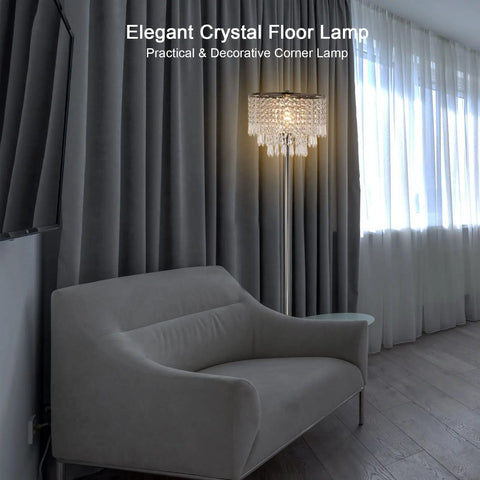 Three Layer K5 Crystal Floor Lamp With Sparkling Triper Layer Shade beside a grey sofa, modern chrome finish, 66.9 inch tall