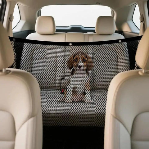 Heavy Duty Mesh Pet Gate For Tesla Cybertruck locks down rear space; mesh divider keeps a dog seated in the back seat.