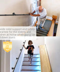 Straight Up Reliable Black Industrial Pipe Handrail Heavy Duty Steel Staircase Banister used by an elderly man and child for safe support