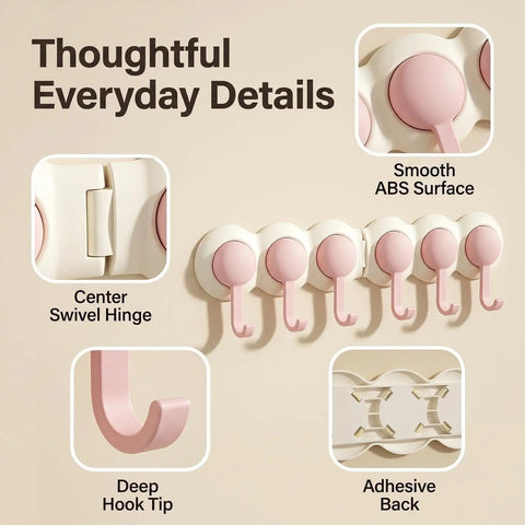 Game Changer Adhesive Corner Hooks With Smooth 180 Degree Rotation Foldable Rack, showing six pink hooks and adhesive backing.