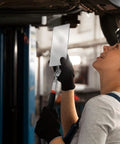 Mechanic using Telescoping Rectangular Inspection Mirror With 360 Degree Rotation for underbody vehicle check in a garage