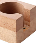 Natural wood espresso tamper station showing 58mm holder and pocket for dosing needles, perfect for home cafe setup.