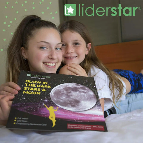 Two children holding Glow In The Dark Ceiling Stars And Moon Wall Decals for Kids Bedroom or Nursery package with moon graphic