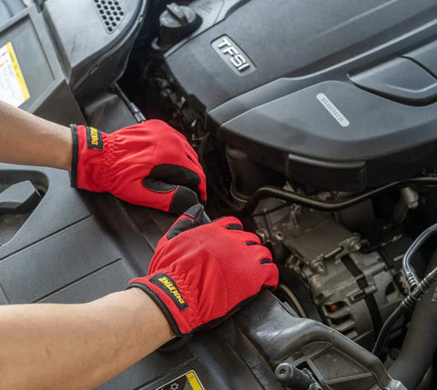 Hands wearing red Three Pack High Dexterity Work Gloves For Men With Touchscreen Compatibility performing car engine maintenance.