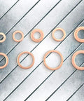 Kick Ass 200 Pc Copper Flat Washer Gasket Kit Assorted M5 M6 M8 M10 M12 M14 Sizes High Conductivity Sealing Rings For Sump Plugs Fuel Hydraulic Fittings Leak Proof Stoppers Plus Transparent Storage Box Ready For Your Home Garage Repairs copper flat washers on metal surface