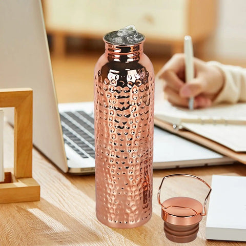 Copper Water Bottle With Easy Temperature Control And Built Tough Leakproof Insulated Design on office desk