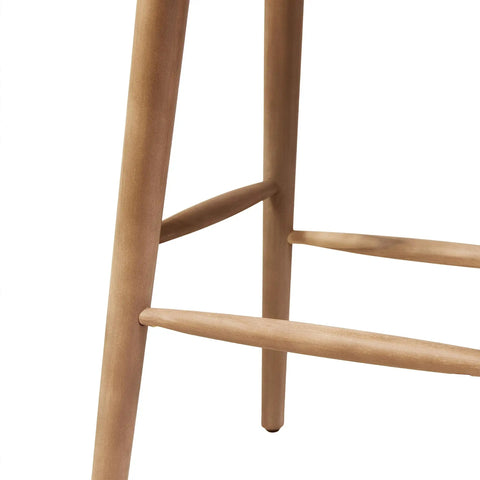 Close-up of leg detail on Magwen Outdoor Acacia Wood Barstool With Wicker Set Of Two Rustic Patio Seating, light brown wood.