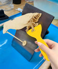 Using Must-Have 7-Piece UV Resin 3D Printer Cleaning Kit with silicone spatula to remove print from build plate