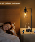 Bedside Table Lamp With USB C Charging Port And Outlets Fully Stepless Dimmable Black Desk Lamp With Glass Shade by a bed