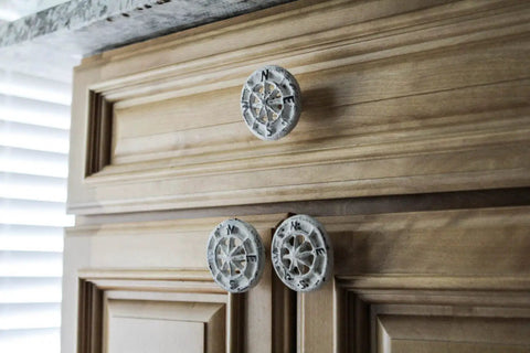 Rock Solid Compass Rose Drawer Pulls Set Of 12 In Antique White Cast Iron Nautical Cabinet Handles on wooden kitchen cabinets.