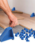 Triangle Floor Spacers For Laminate Wood And Vinyl Plank Installations, blue plastic spacers, 1/4 inch gap setup on floor