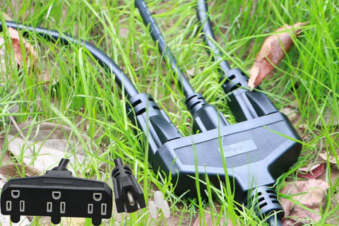 Heavy Duty 3 Outlet Outdoor Extension Cord 10 Ft 14 AWG 15 Amp Waterproof Power Strip with prongs on green grass.