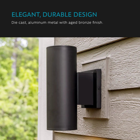 Carter 2-Light Outdoor Wall Lantern With Built-In GFCI Outlet In Aged Bronze mounted on exterior wall
