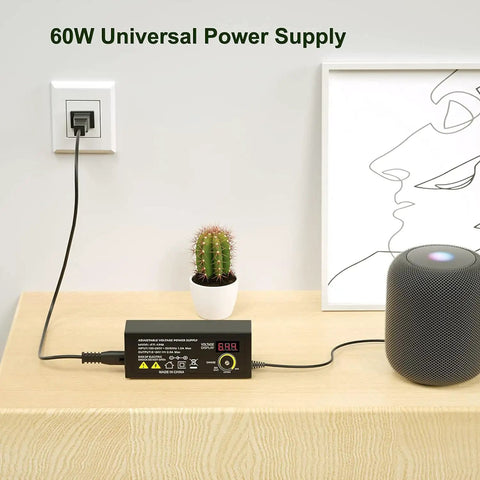 Beefed Up 60W Adjustable 24V Power Supply With LED Voltage Display on a table, showing AC to DC switching setup next to electronics