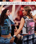 Two women at a festival wearing glow in the dark hydration pack with 3L water bladder, reflective laser bag design