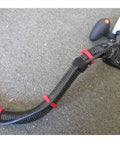 Tear Up Cord Chaos And Tangled Hoses With This Eight Pack Snap Clip Set holding vacuum hose tightly on carpet.