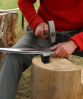 Using a Two Piece Peening Anvil Set For Scythe Blades In Drop Forged Steel With Flat Striking Surface And Glossy Finish For Precise Peening