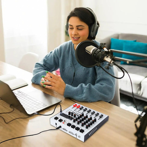 Person podcasting with 4 Channel DJ Mixer With Bluetooth And USB Interface, 5 Band EQ, 99 DSP Effects, 48V Phantom Power on desk