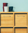Vintage Brass Cabinet Handle With 96mm Centers Double Hole For Kitchen Cabinets on wooden drawers, mugs on top
