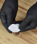 Gloved hands kneading Fix It Multi Purpose Epoxy Putty 4 Oz for quick leak sealing and pipe repairs.