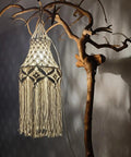 Cozy Boho Plug In Pendant Light With Handmade Macrame Shade 15 Foot Hanging Cord LED Bulb Included With Adjustable Color Temperature 2700K 4000K 5000K On Off Switch Ideal For Bedroom And Living Room Decor hanging on artistic branch.