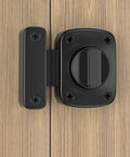 Sliding Door Lock Zinc Alloy Universal Wardrobe Catch Bolt Gate Latch mounted on wooden door, featuring a black finish and sturdy design.