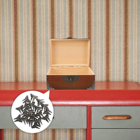 Old School Box Corner Protectors Set For Wood Furniture And Cabinets, metal edge guards displayed with a wooden box.