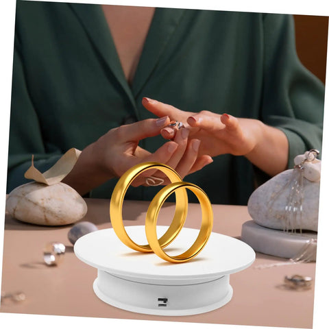 Rorpoir Adjustable Electric Rotating Display Stand For Jewelry And Watches With Anti Skid Base Energy Saving Motorized Turntable showcasing gold rings.