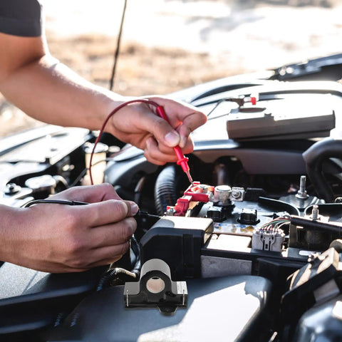 Technician testing engine with Inductive Throttle Sensor Upgrade for Golf Carts in foreground, metal and plastic build visible