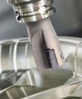 Installed indexable carbide end mill on spindle; nickel-plated, 90-degree square shoulder.