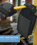 Safebox Portable Safe With 3 Digit Resettable Combination Lock, Slash Resistant Material clipped to a yellow rail.