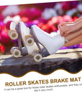 Person tying laces on white quad skates with 2 Pack Braking Block Roller Skate Toe Stops For Quad And Inline Skates attached