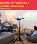 Universal Laptop Projector Tripod Stand Foldable Design Heavy Duty Workhorse Mount in a living room setup projecting a football game
