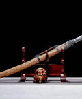 Xiuchun Dao Chinese Sabre Hand Forged Manganese Steel With Teak Wood Scabbard And Textured Alloy Fittings on display stand