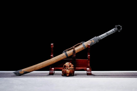 Xiuchun Dao Chinese Sabre Hand Forged Manganese Steel With Teak Wood Scabbard And Textured Alloy Fittings on display stand