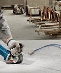 Compact Soft Start Module For Angle Grinders Smooth Power Ramp Up Kills Sudden Jerks on workspace with grinder.