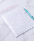 White Bubble Mailers 30 Pack 6x8 Inch Padded Envelopes For Small Biz Shipping, Heavy Duty Bubble Envelopes shown with pen for scale