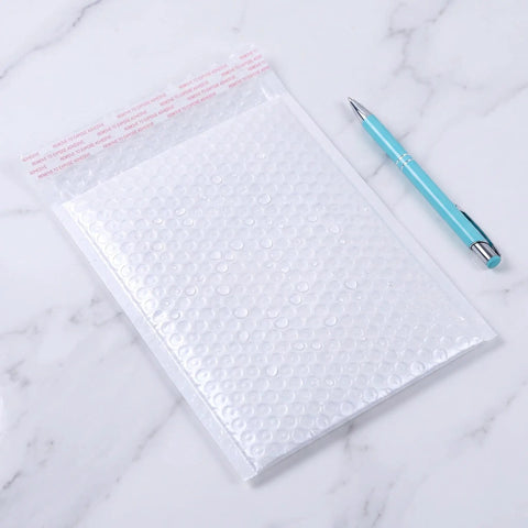 White Bubble Mailers 30 Pack 6x8 Inch Padded Envelopes For Small Biz Shipping, Heavy Duty Bubble Envelopes shown with pen for scale