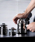 Image of user preparing espresso tools from L E V E L U P Y O U R B R E W G A M E W I T H T H I S S O L I D E S P R E S S O A C C E S S O R I E S K I T.