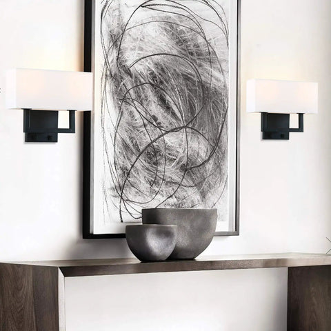 Double Black Wall Sconce Set With White Textile Shades And Easy On Off Switch Modern Living Room Bedroom Bedside Lighting Fixture For Cozy Vibe Lighting Works With E26 Bulbs And Dimmable Options installed beside abstract wall art